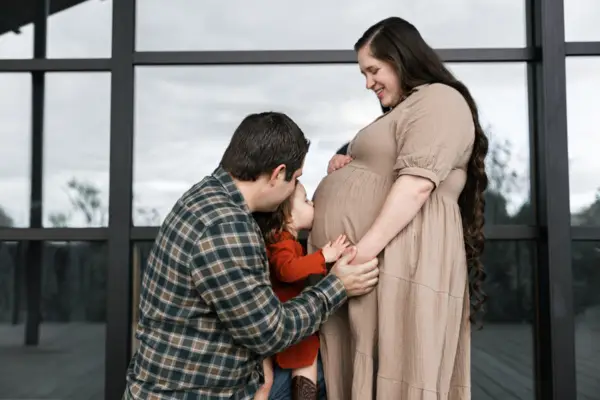 Toddler Kissing Pregnant Mom Belly