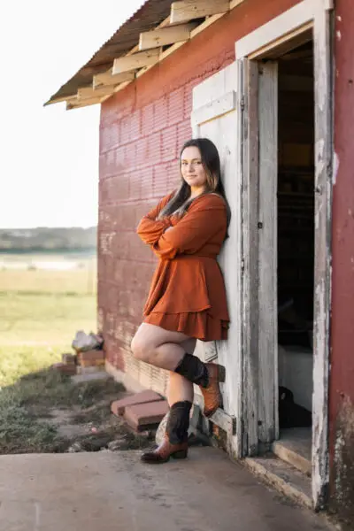 Senior Girl Grad Standing Leaning Against Wall Photo Pose