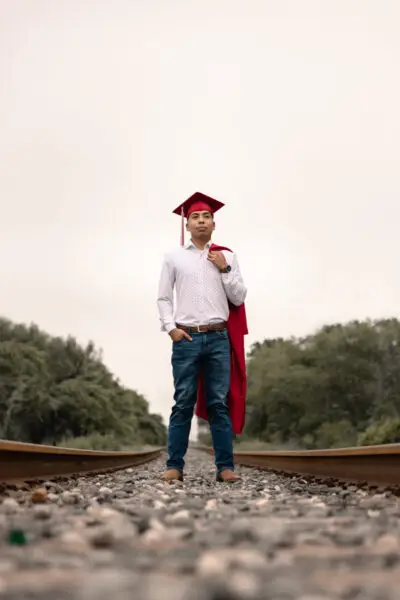 Senior Grad Standing Superman Pose