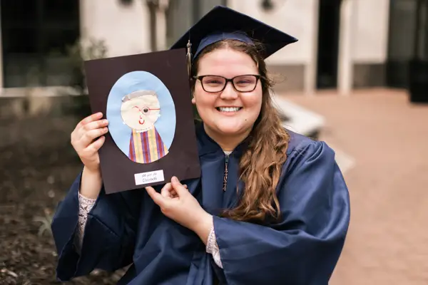 Senior Graduate Photo With Special Memento Idea