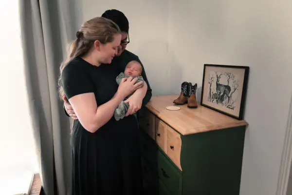 Family Shot With Favorite Memento In Newborn Photography