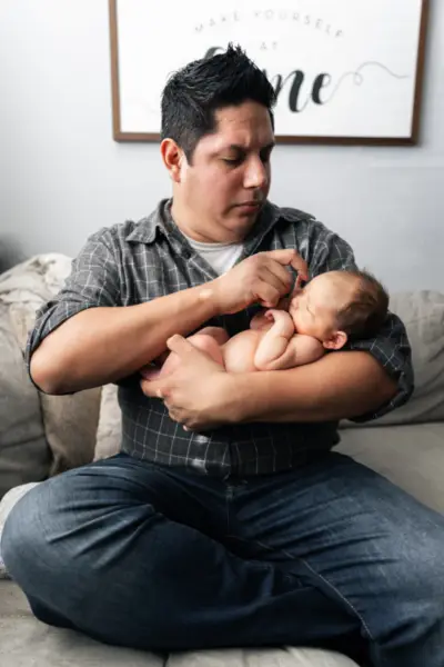 Father Holding Newborn