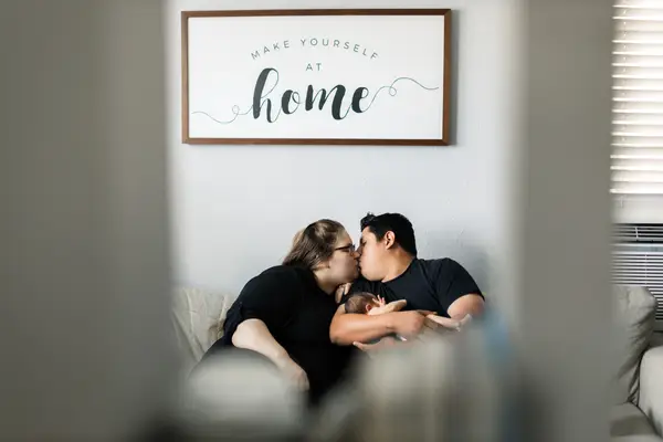 Parents And Newborn Home Photoshoot