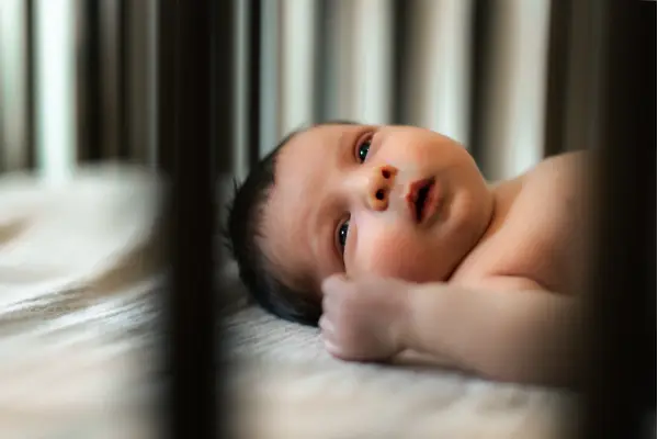 Shooting Through Crib Bars For Newborn Photoshoot
